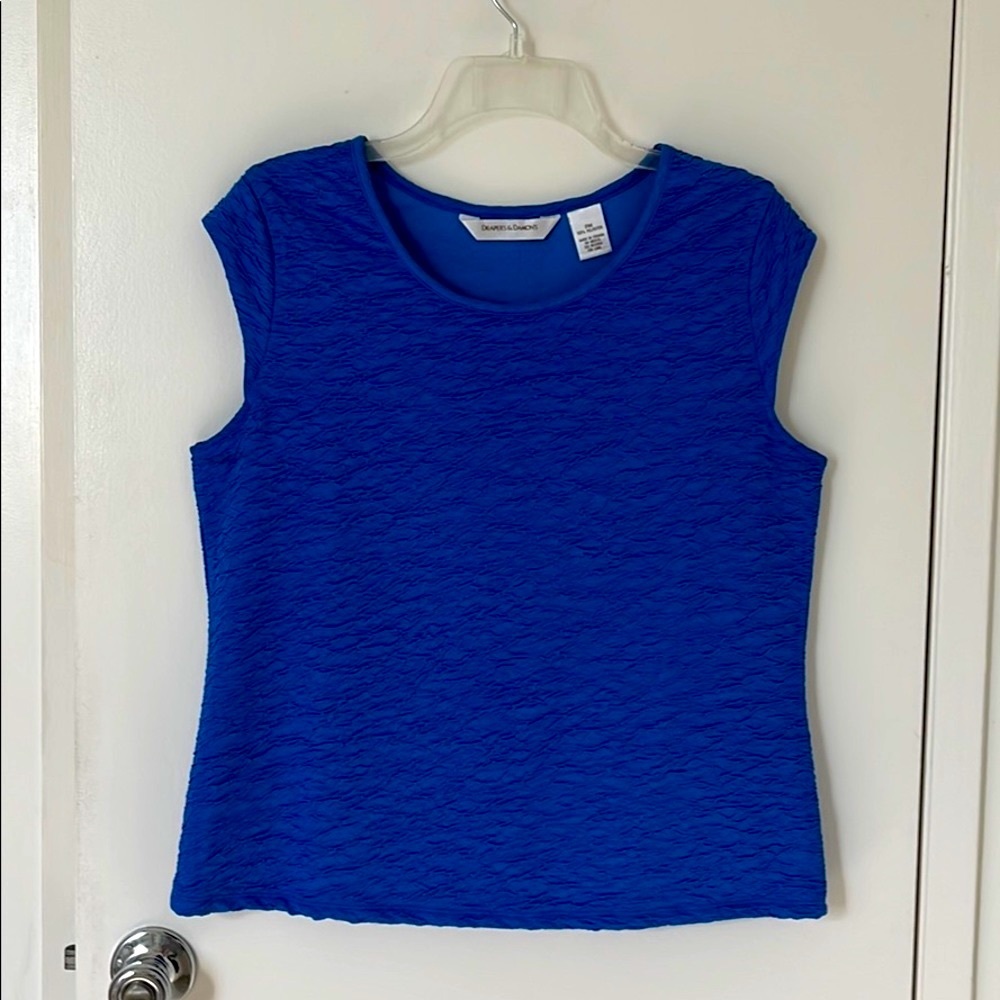 Blue, sleeveless, “puff texture” scoop-neck top